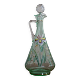Old carafe enamelled with glass flowers