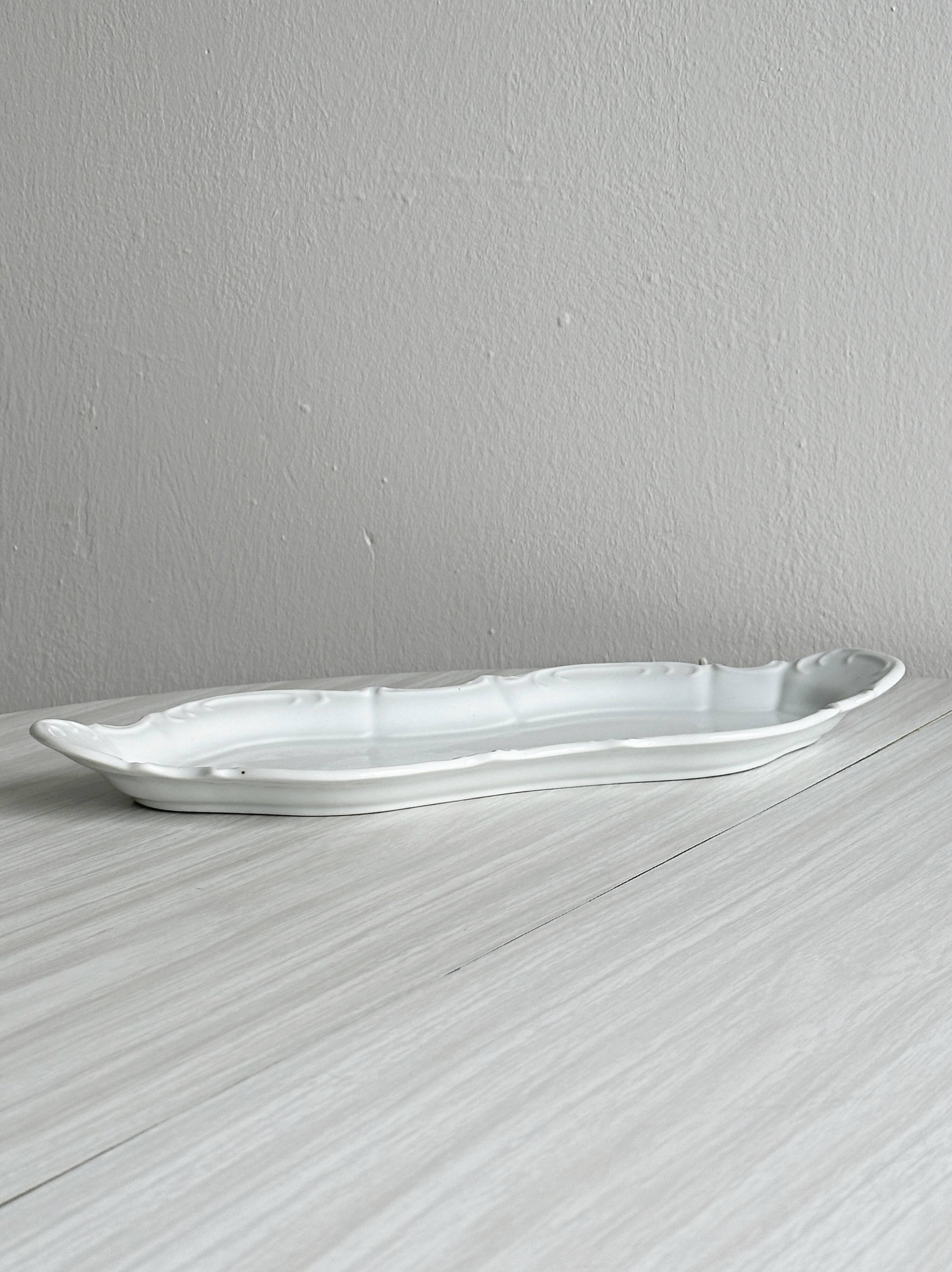 white porcelain plate in an unusual shape