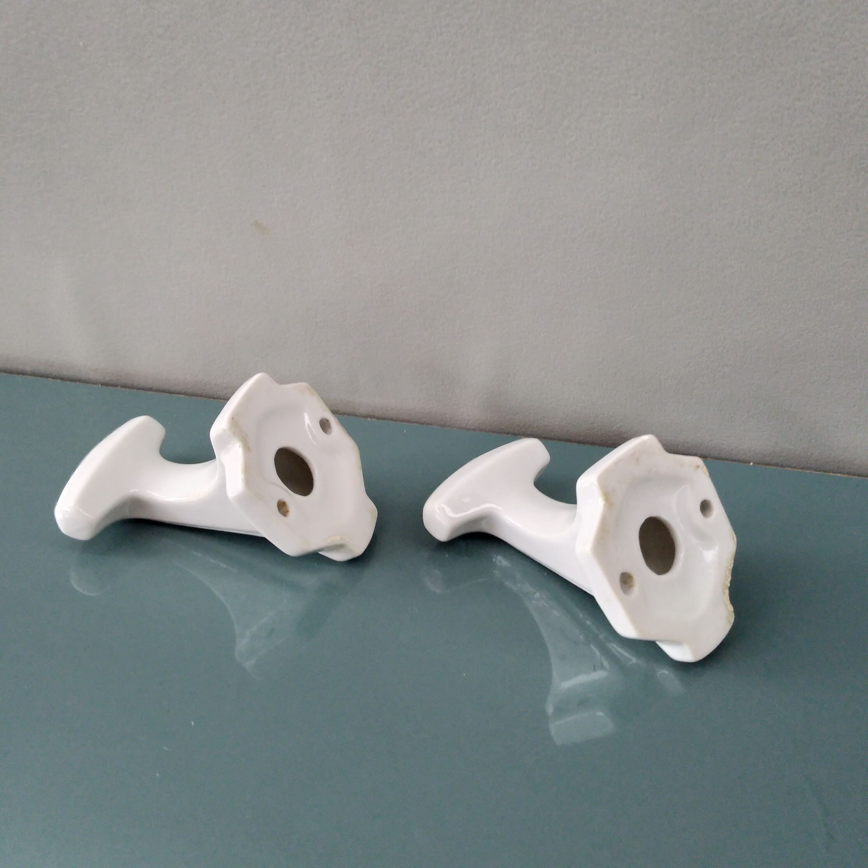 Pair of art deco porcelain coat racks