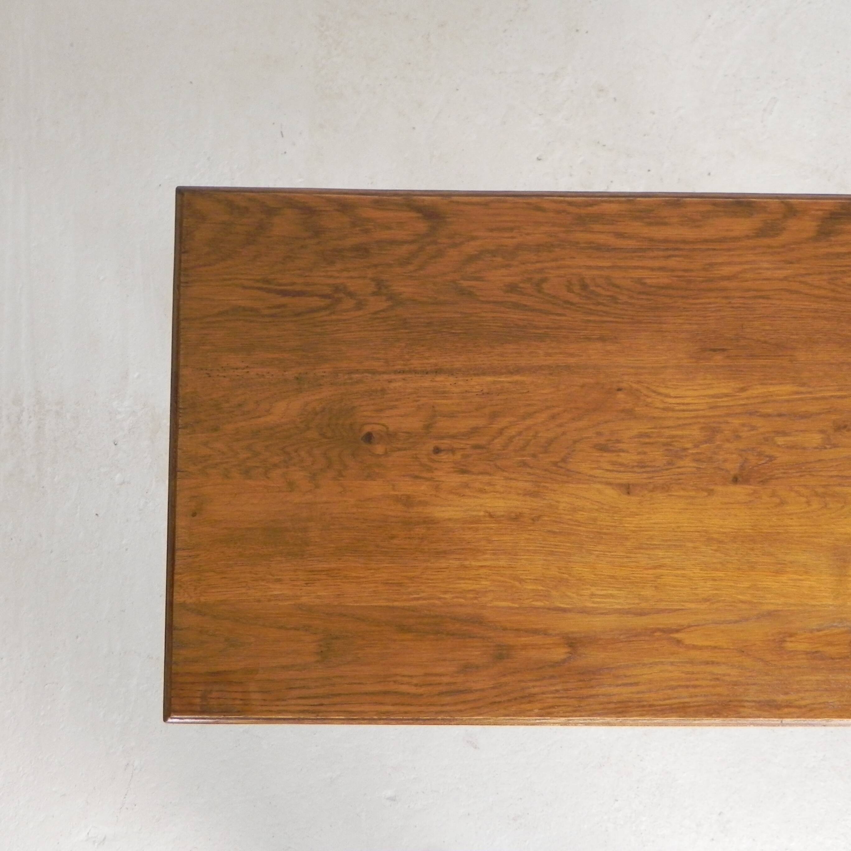 Bistro table with an oak top on a cast iron base, 1930s.