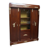 Empire style mahogany display bookcase with gilt bronze decoration and three doors.