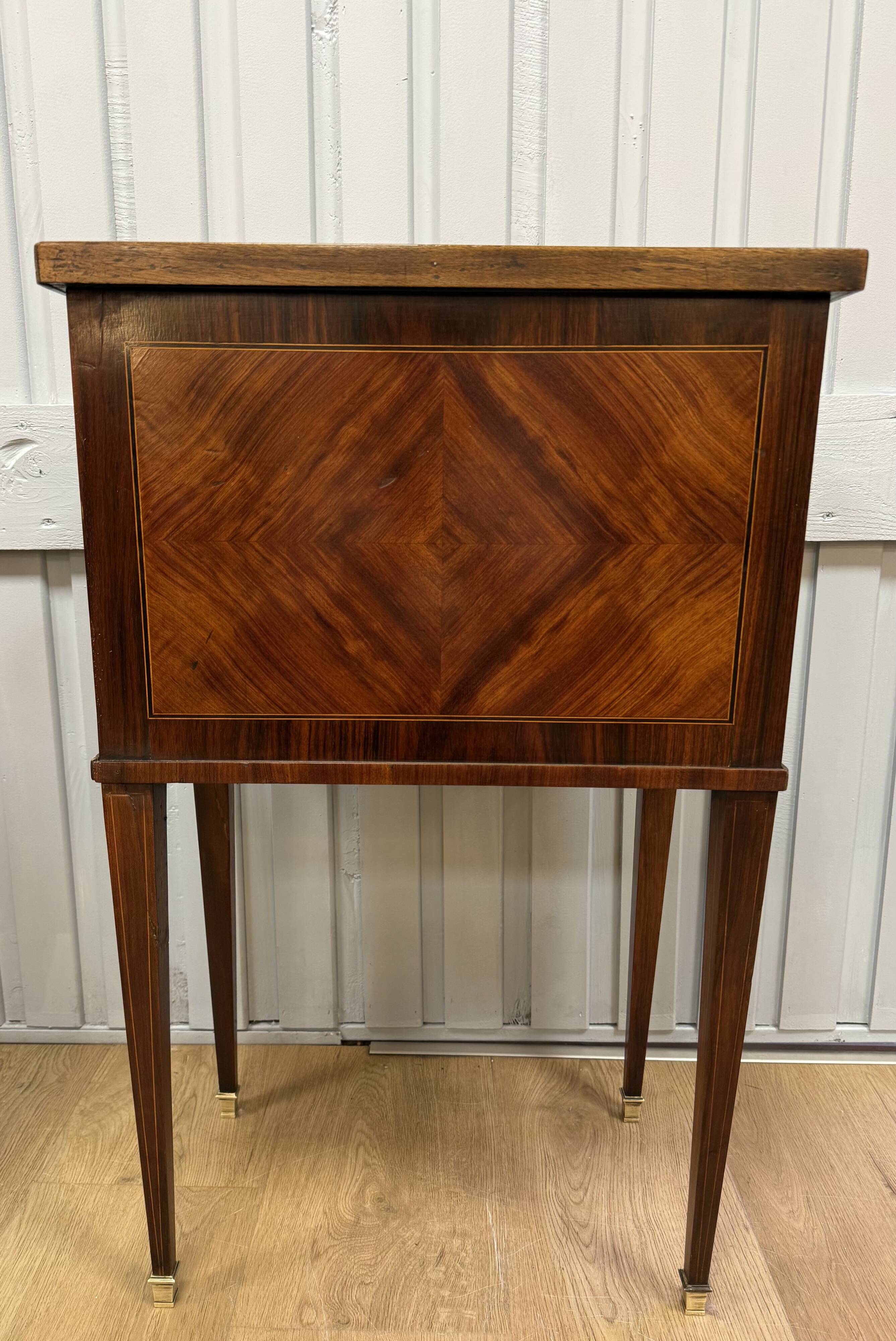 Side table with a faux book front.
