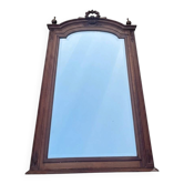 Miroir trumeau en bois naturel sculpté à fronton, style Louis XVI, fin XIXe