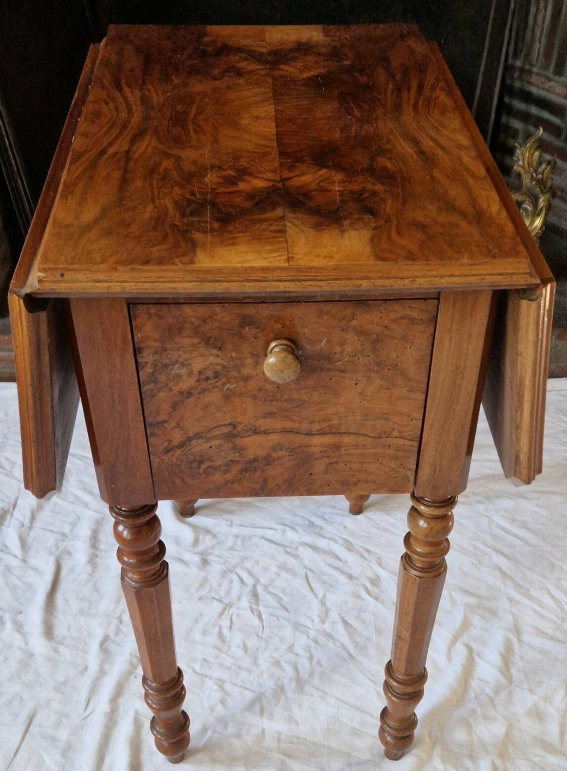 Nineteenth-century walnut work table with flaps, large storage + secret drawer.