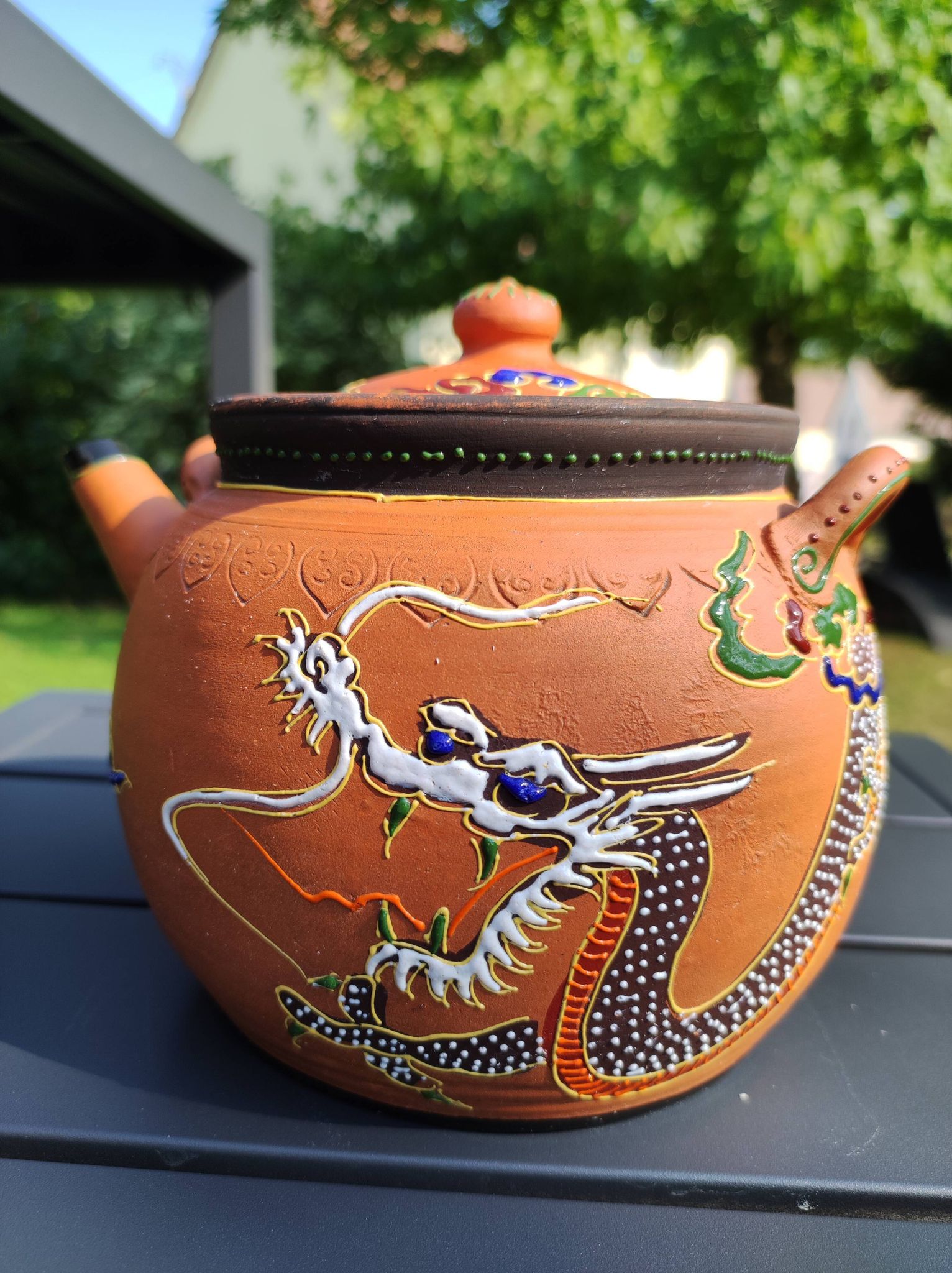 Antique decorative Japanese teapot in terracotta orange tones, with multico enamelled dragon decoration