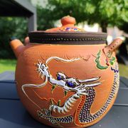 Antique decorative Japanese teapot in terracotta orange tones, with multico enamelled dragon decoration