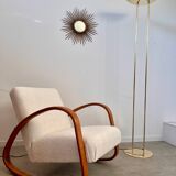 Old golden brass floor lamp with Italian design bulb from the 70s vintage