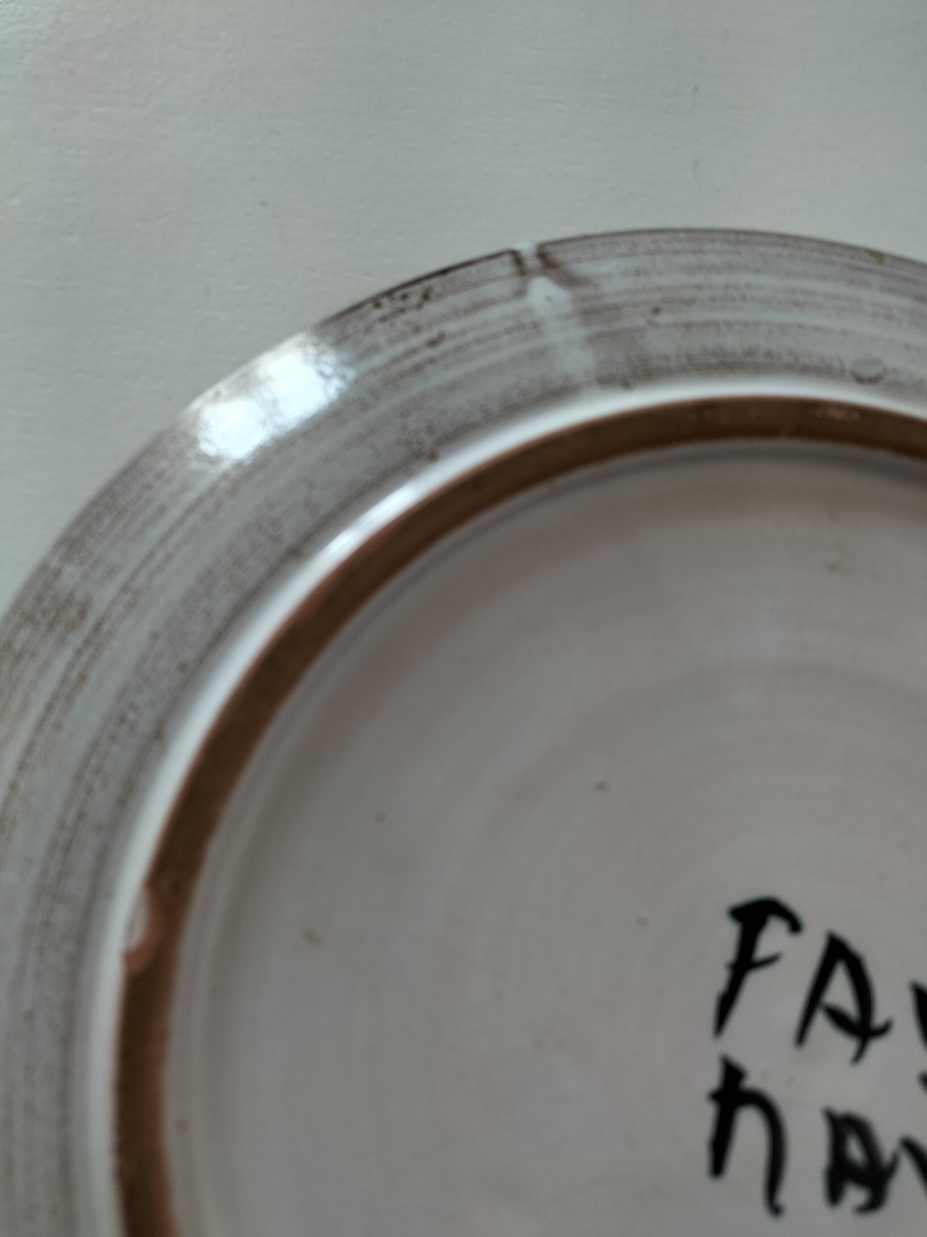 Glazed stoneware plate with floral motif