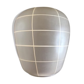 Transparent opaque glass globe streaked with white lines
