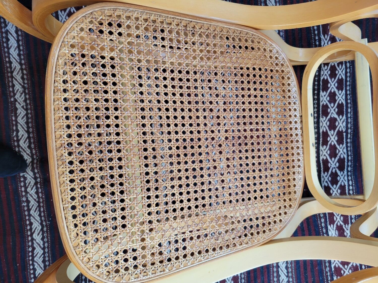 Rocking chair in arched wood and cane