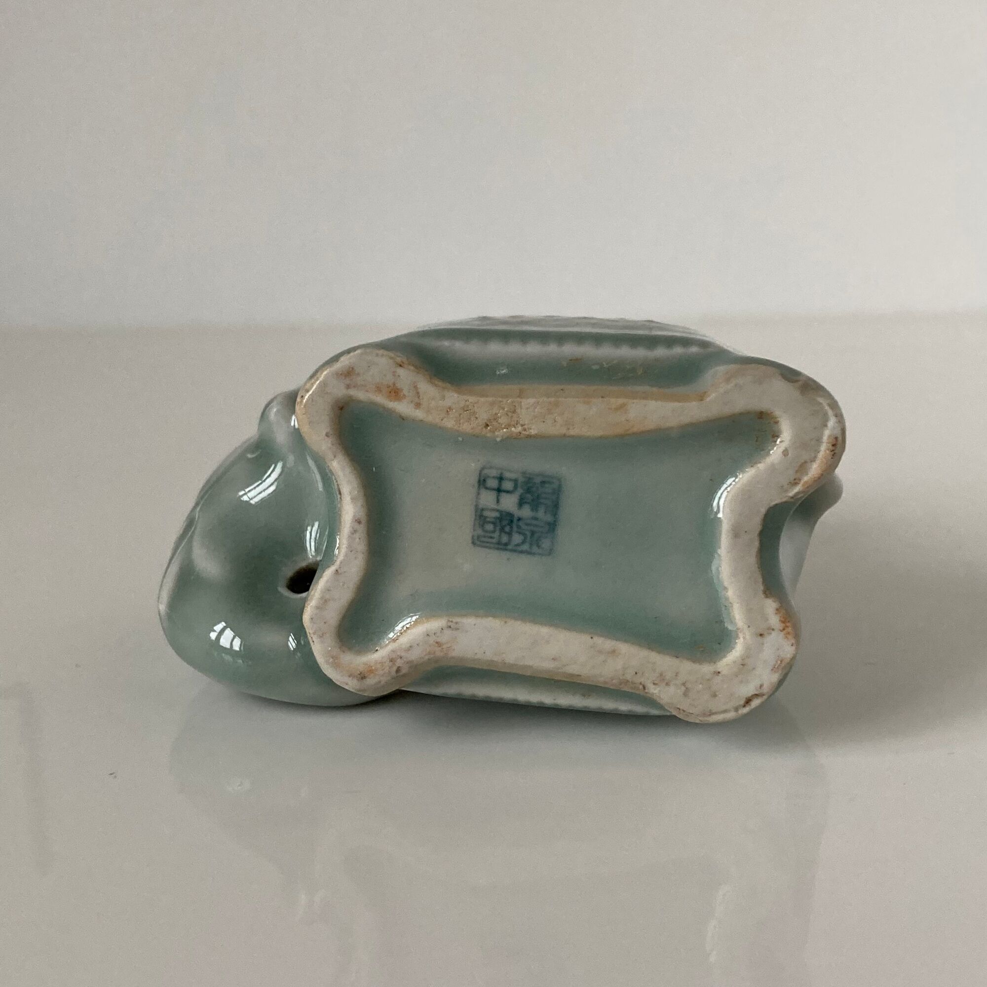 Porcelain candle holder and celadon cover in the shape of an elephant