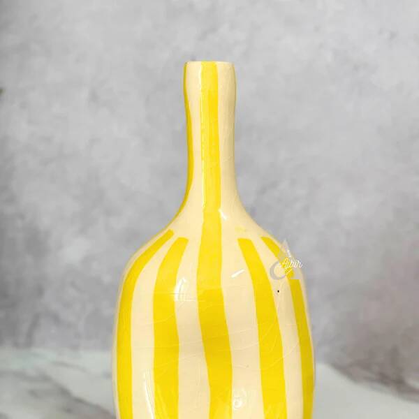 Striped yellow hollow bottle vase