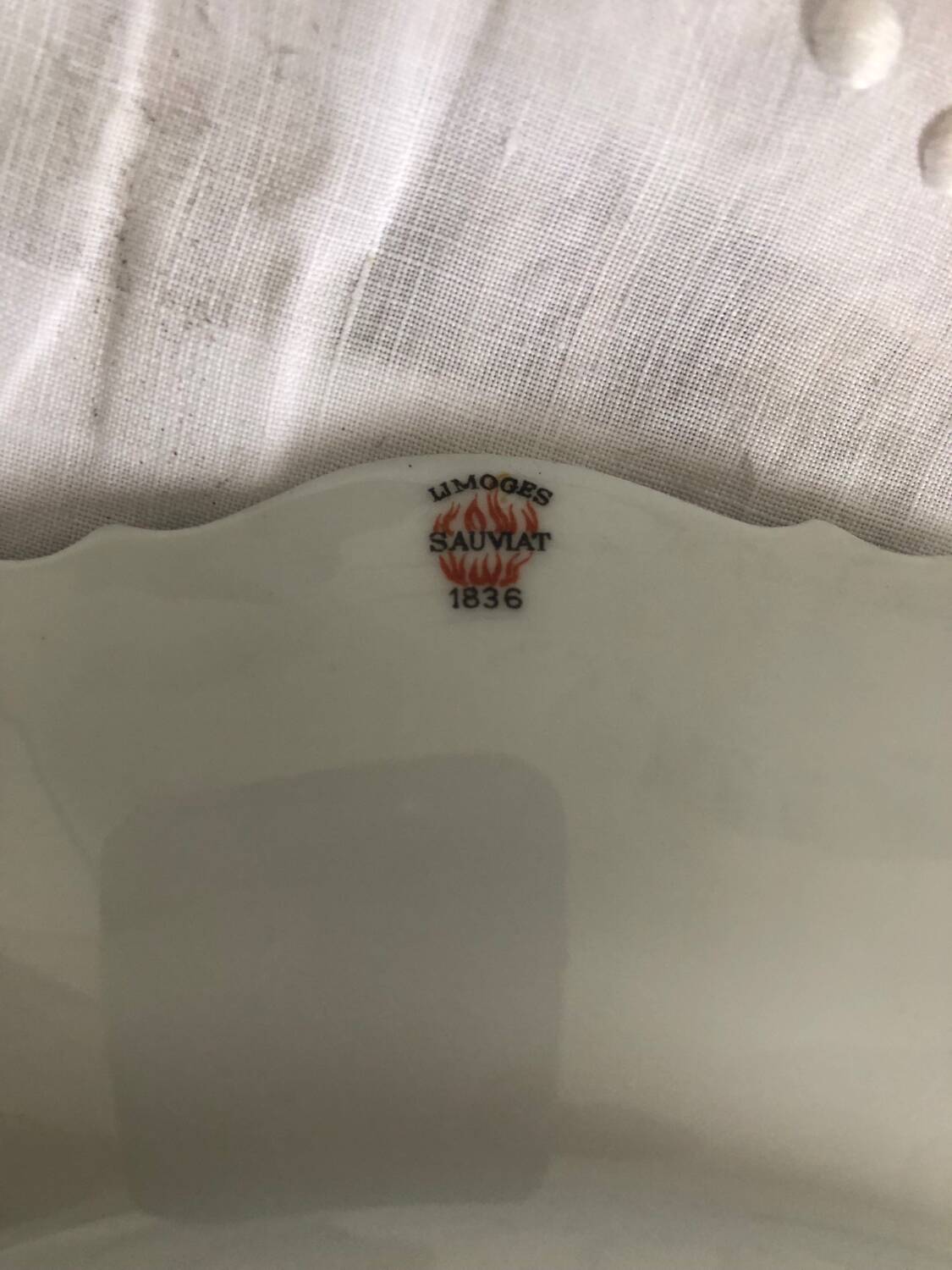 Set of 4 antique Giraud Sauviat porcelain plates.