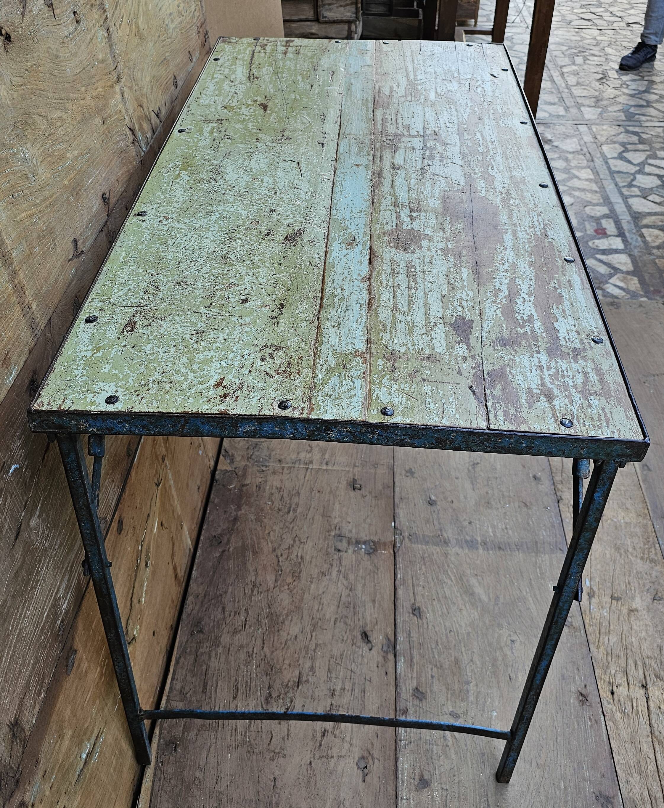 Old folding table in Burmese teak and steel