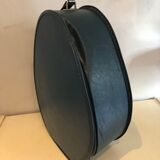 Suitcase has an air hostess hat