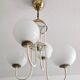 Mid-century modern chandelier with opaline glass balls.