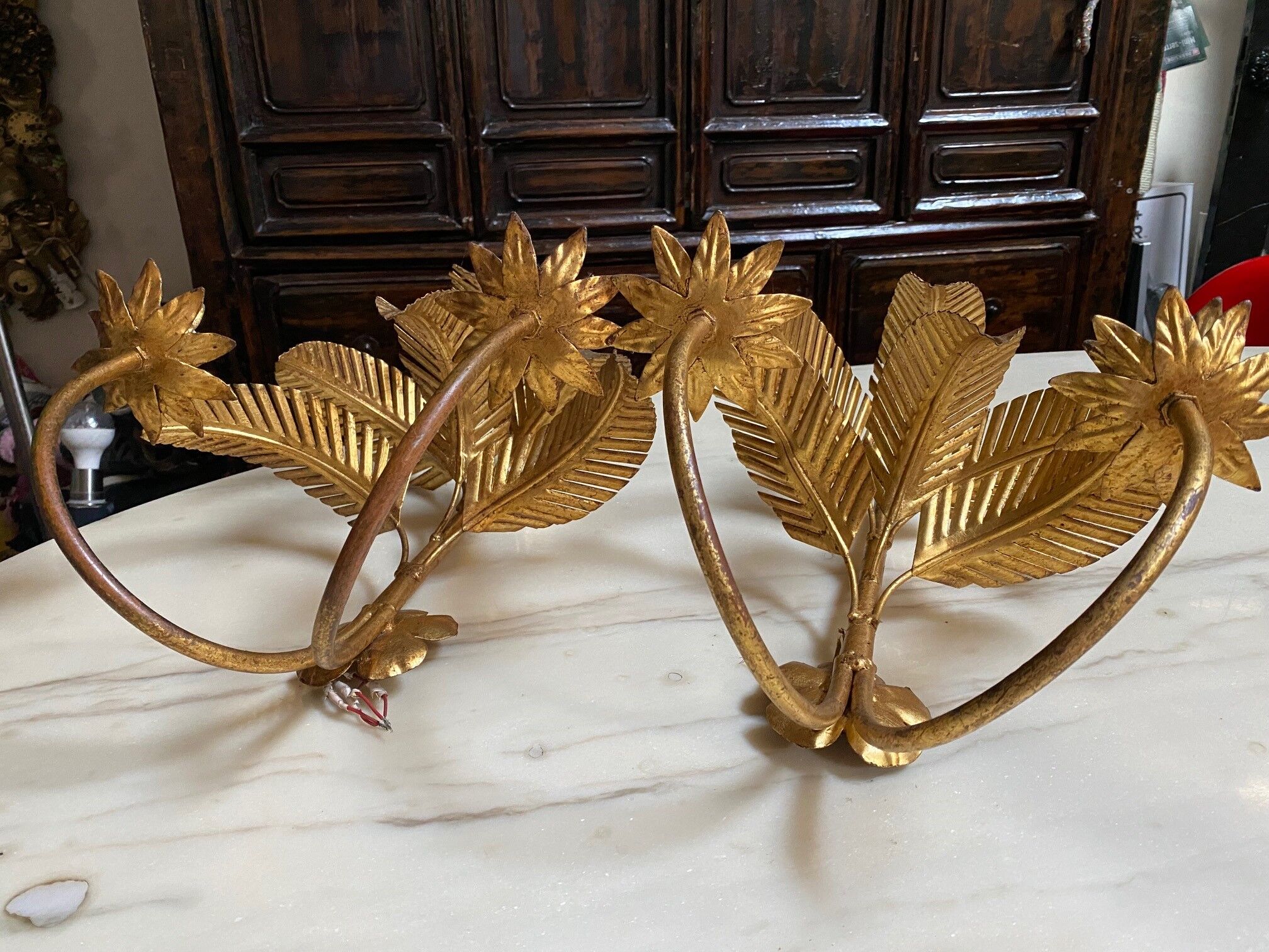 Pair of vintage golden palm leaf sconces