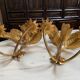 Pair of vintage golden palm leaf sconces