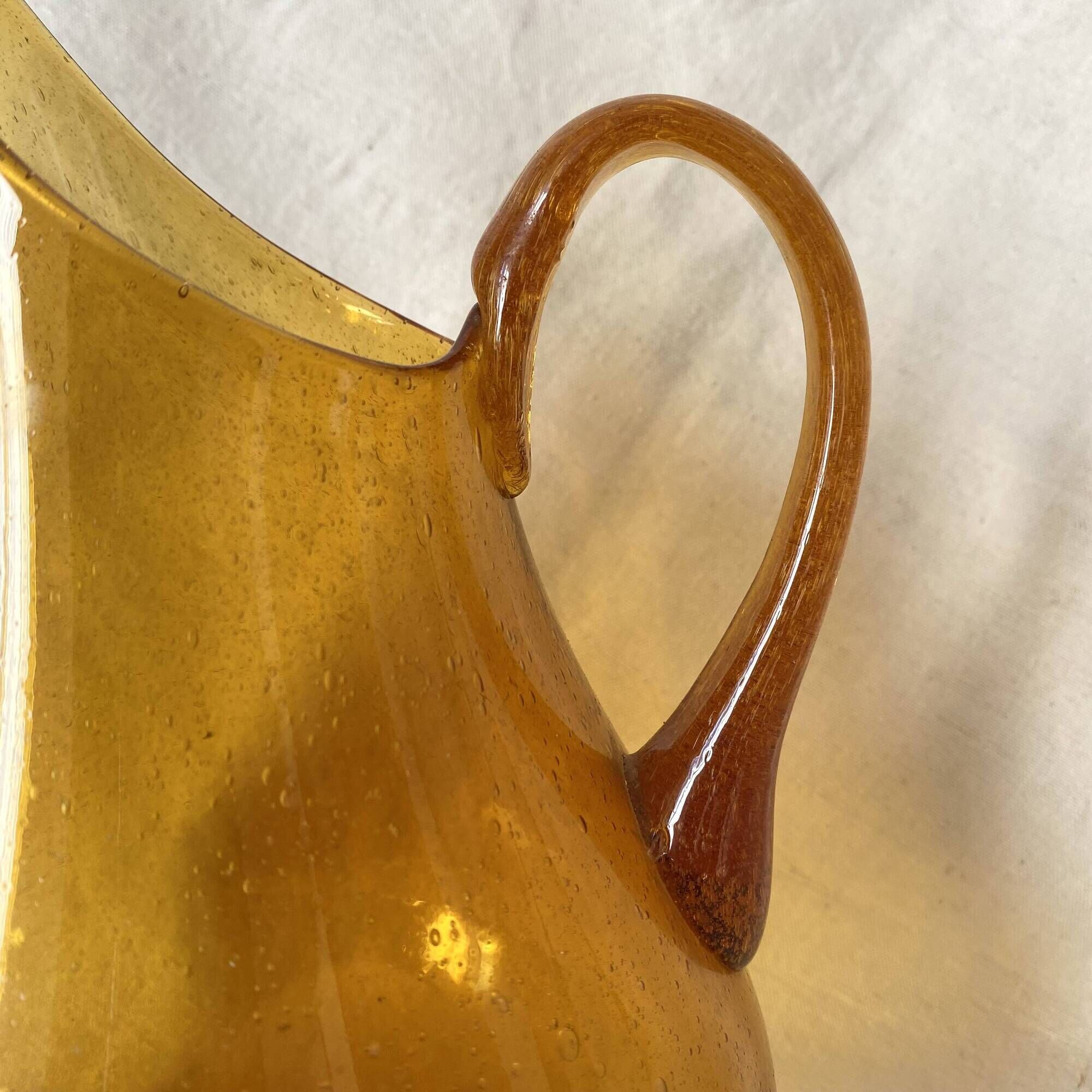 Blown glass jug with caramel bubbles