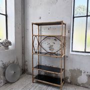 Rattan bookshelf and black glasses