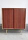 decorative midcentury cabinet with brass legs