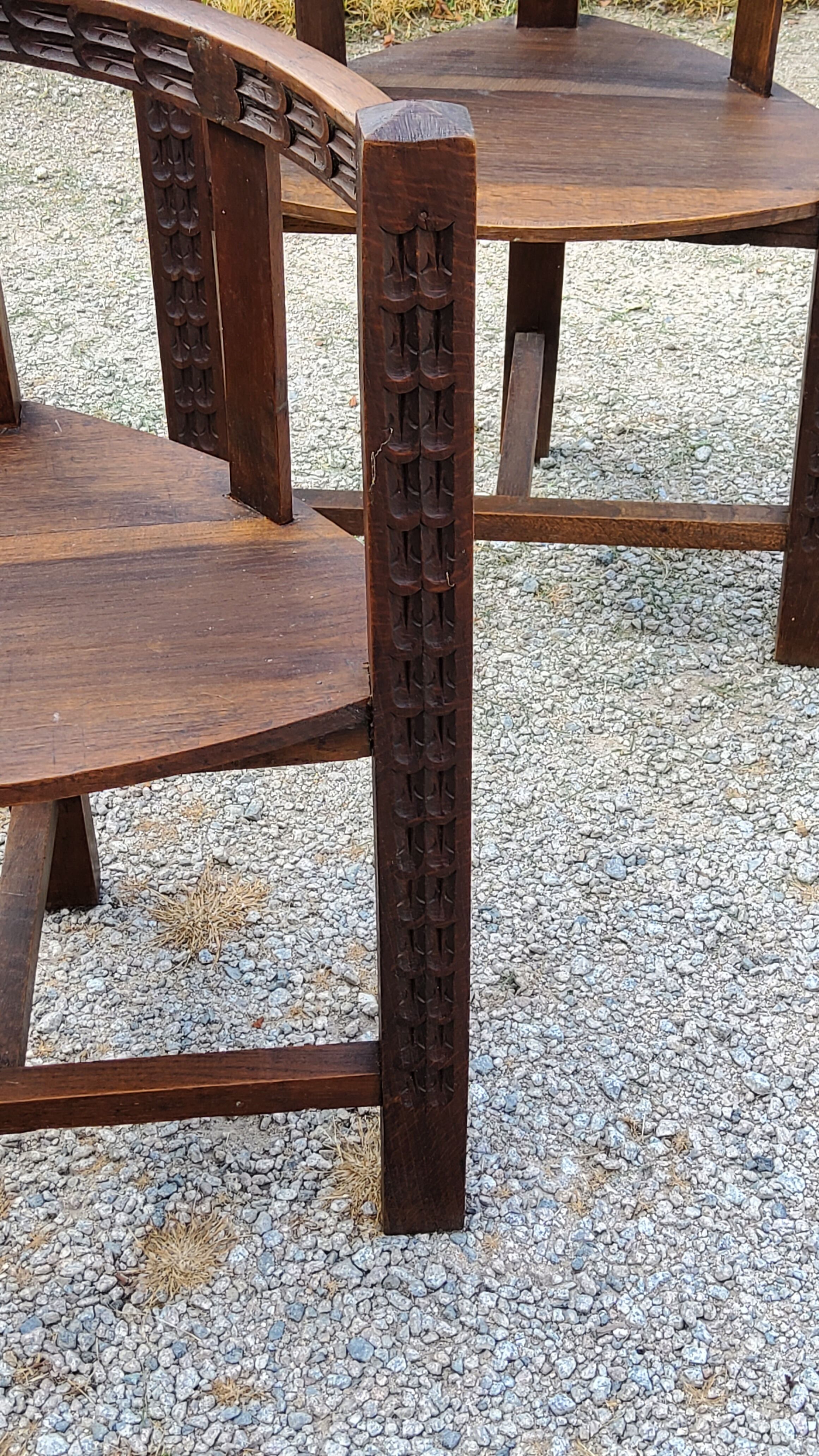 Set of three brutalist tripod armchairs in carved solid oak