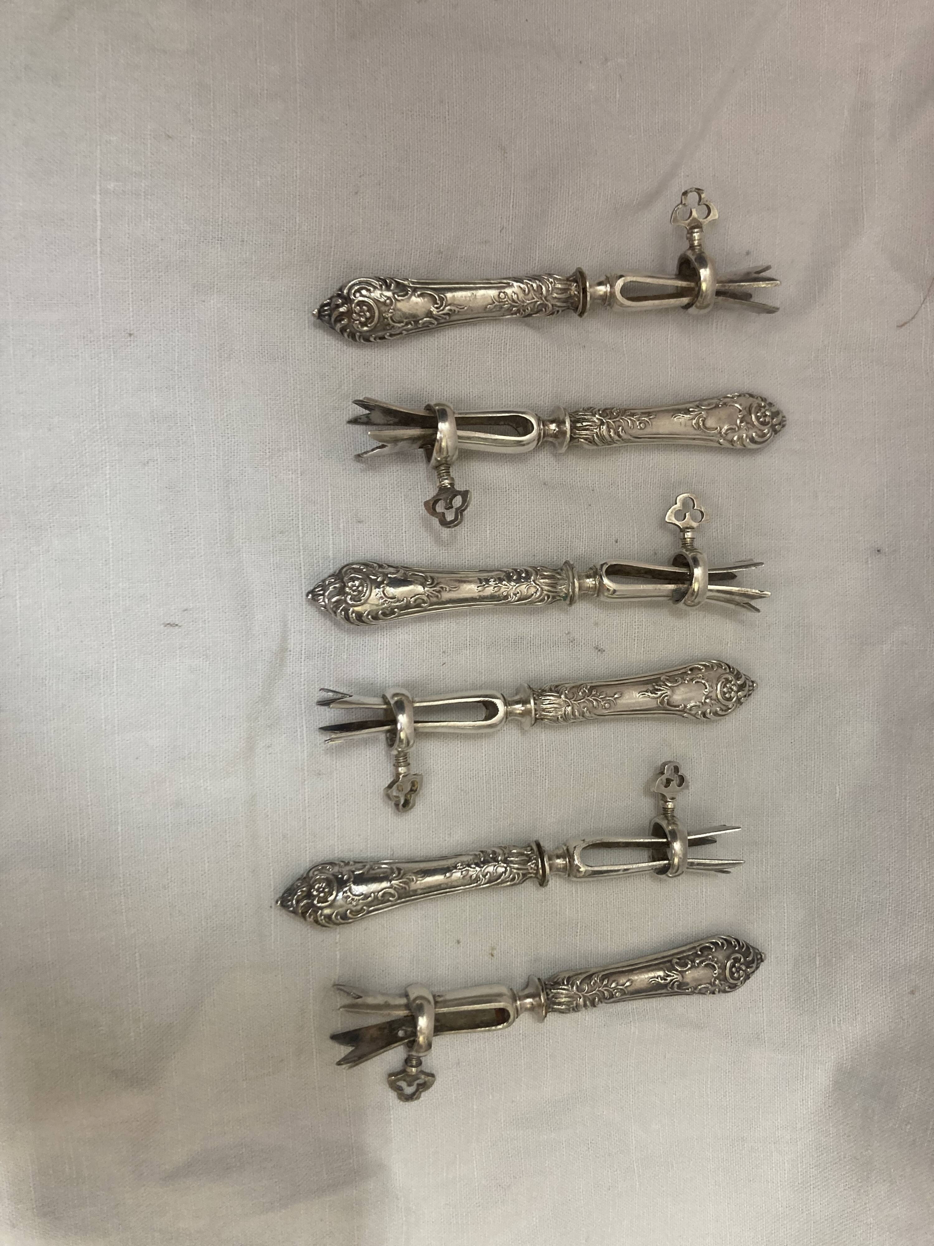 Silver duck sleeve clips, 19th century neck brace