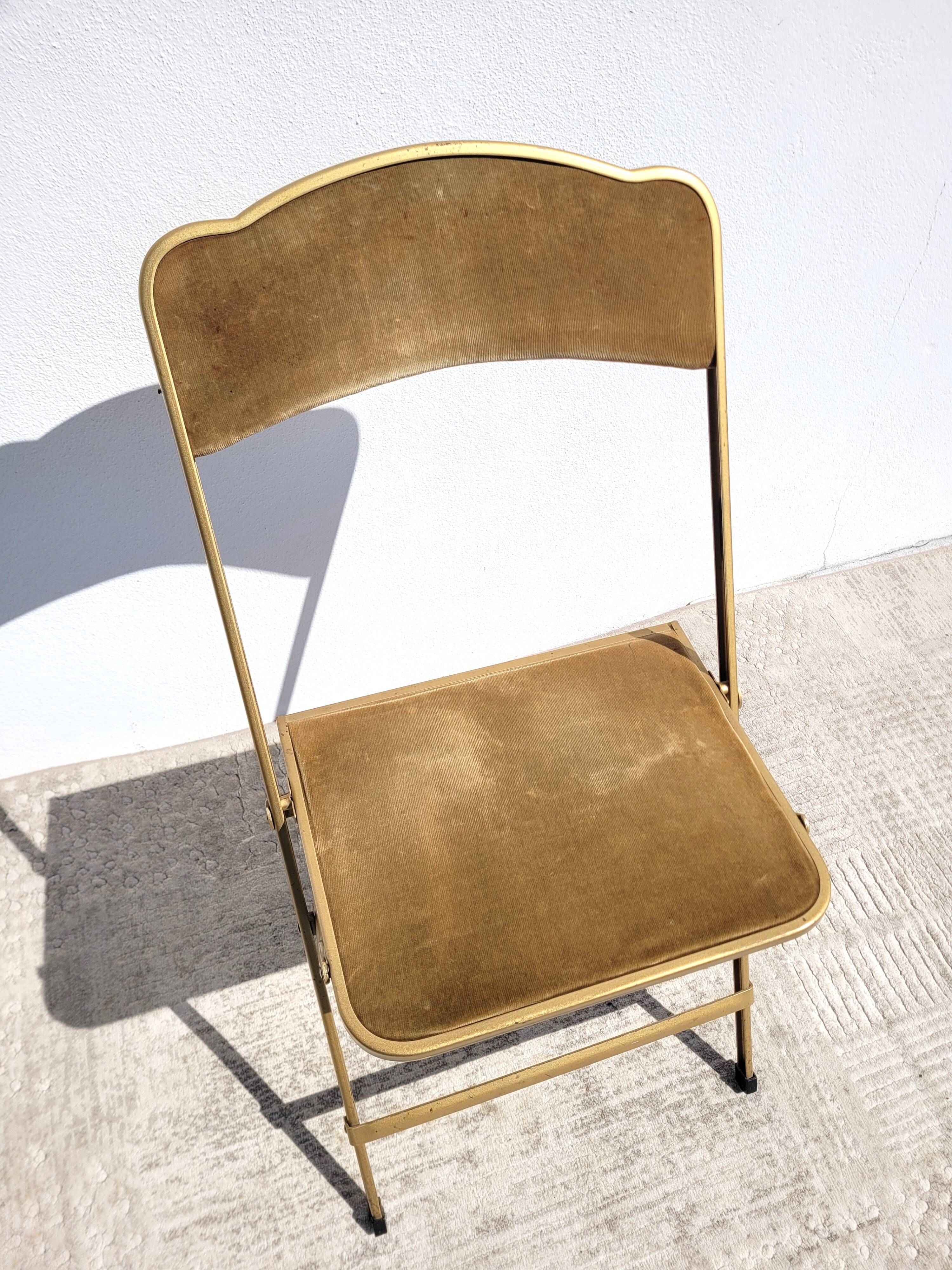 Golden folding opera chair