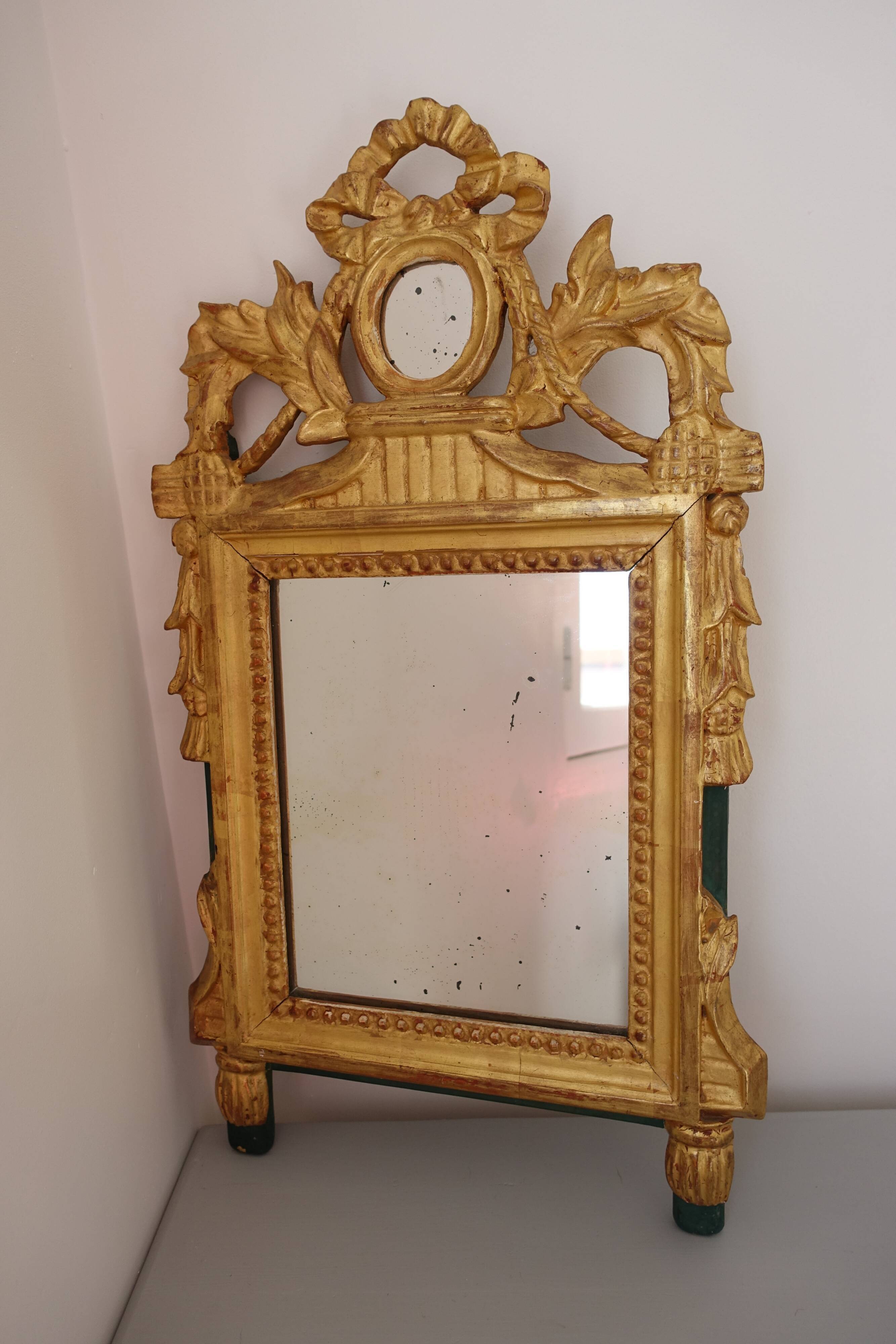 Miroir Louis XVI en bois doré 35x 65cm