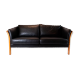 Two seater sofa upholstered with black leather and of danish design