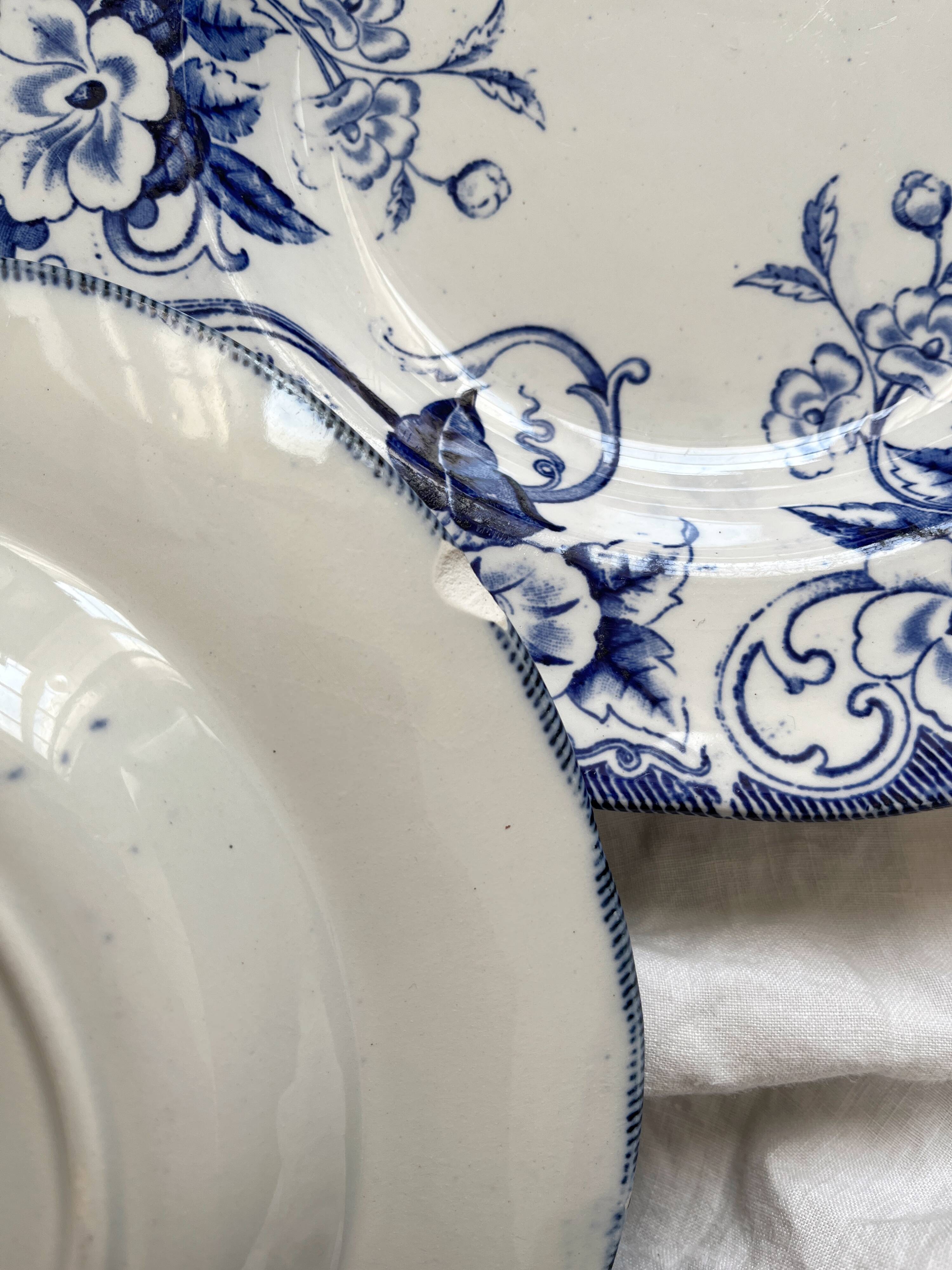 Three Flora ironstone soup plates, Creil and Montereau, late 19th century