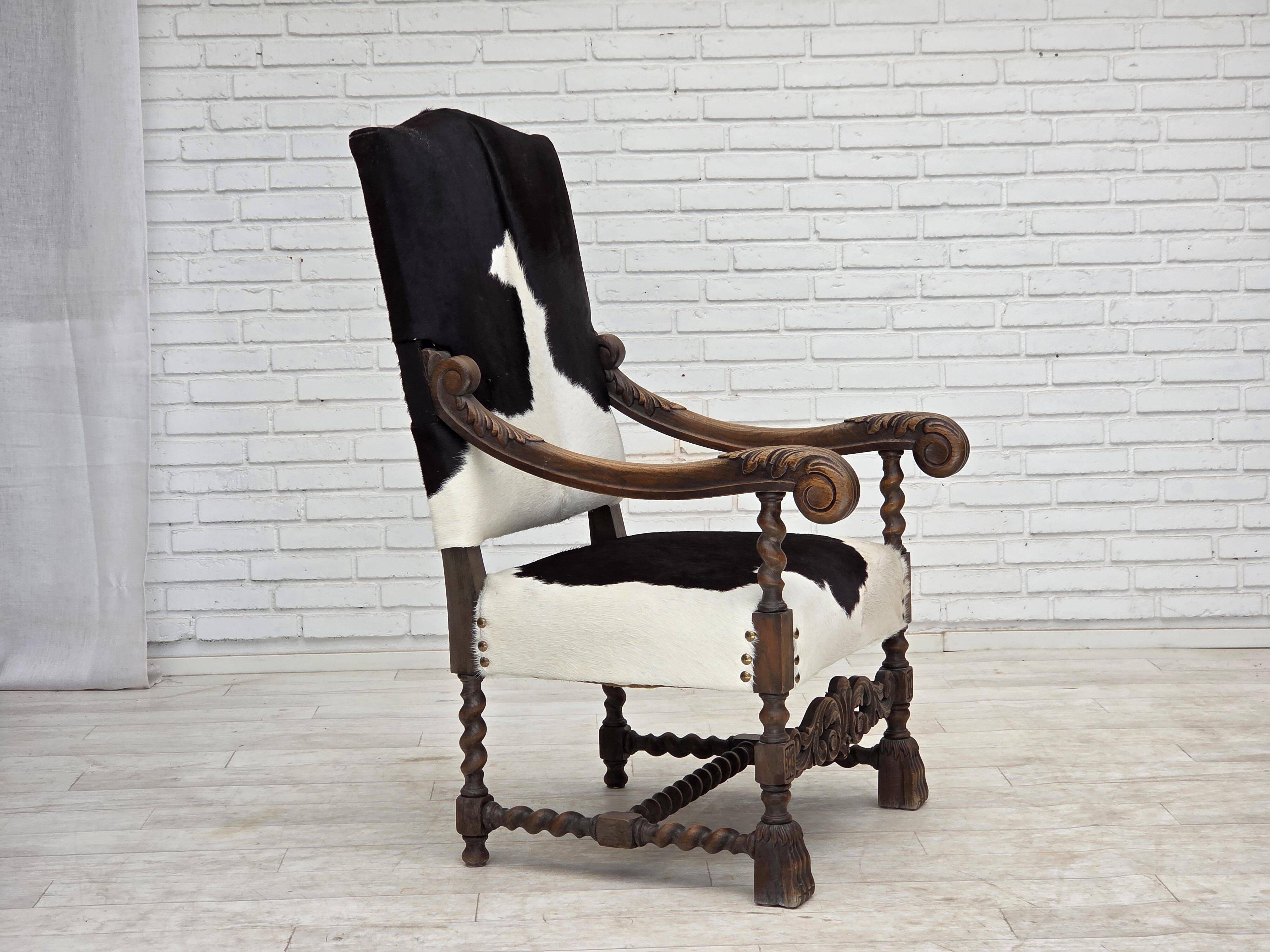 1950s, Danish highback armchair, genuine cowhide, oak wood.