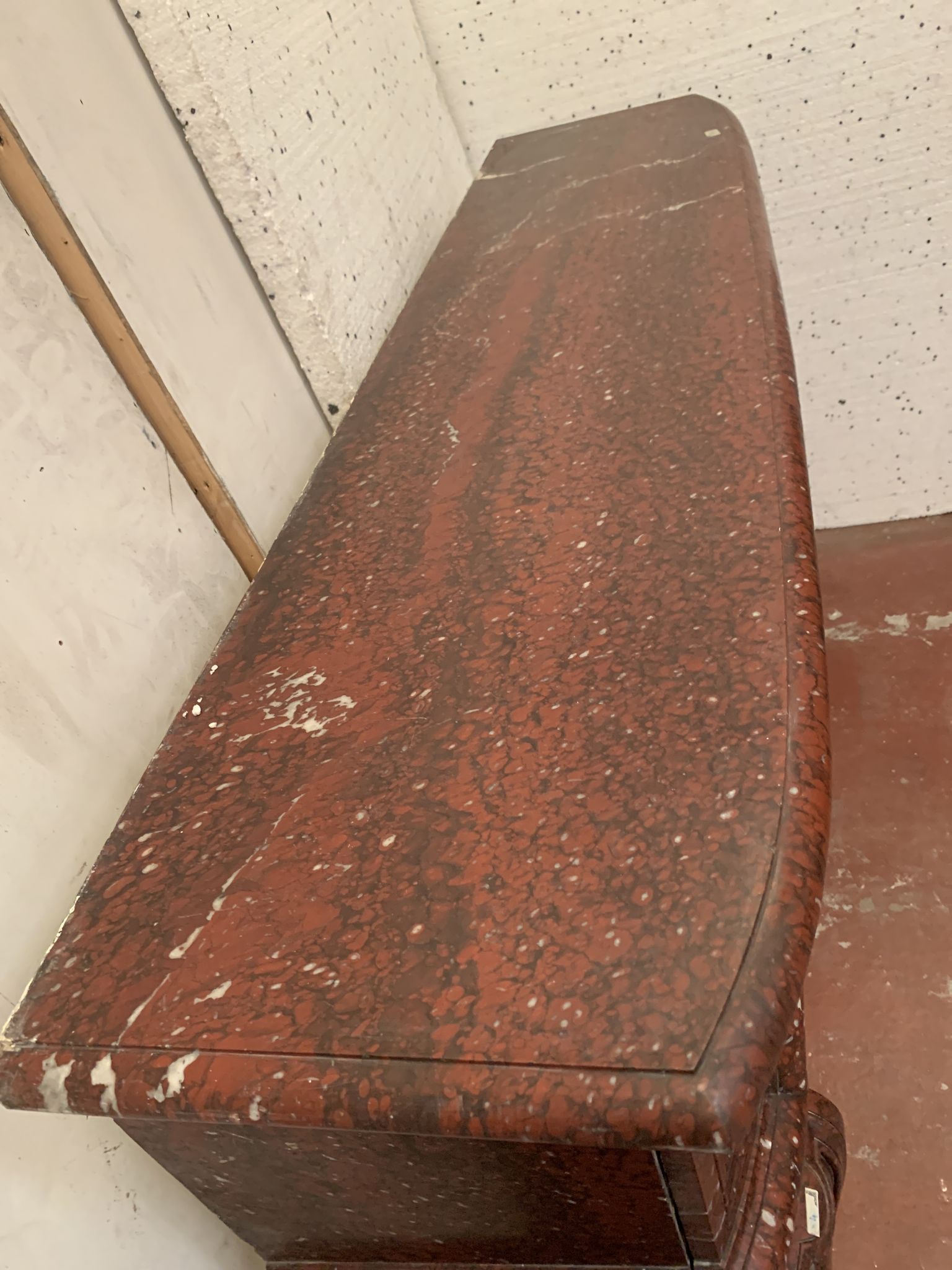 Pair of Louis XIV style fireplaces in red cherry marble. XIX century.