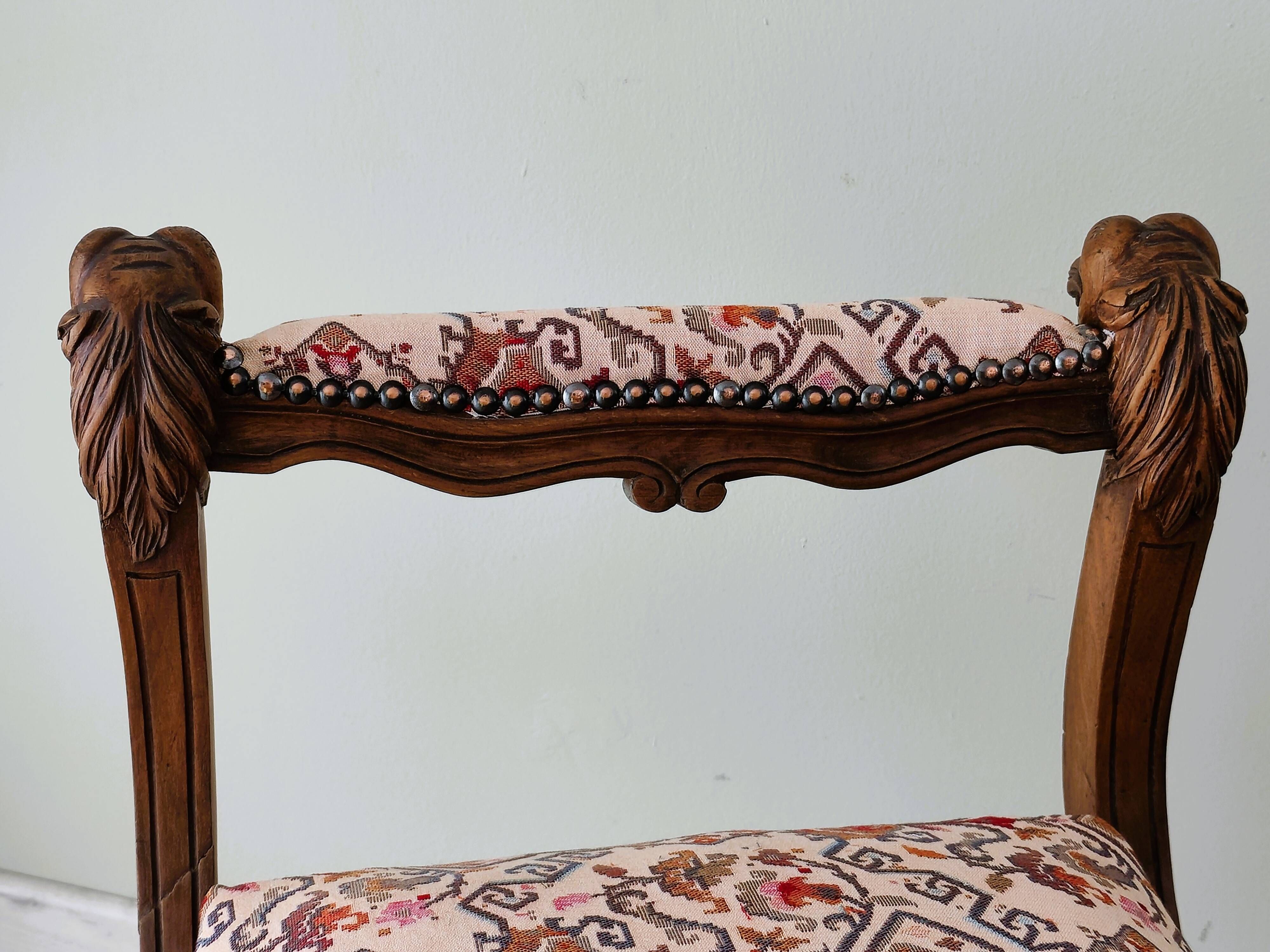 Neo-Renaissance banquette style with lion heads