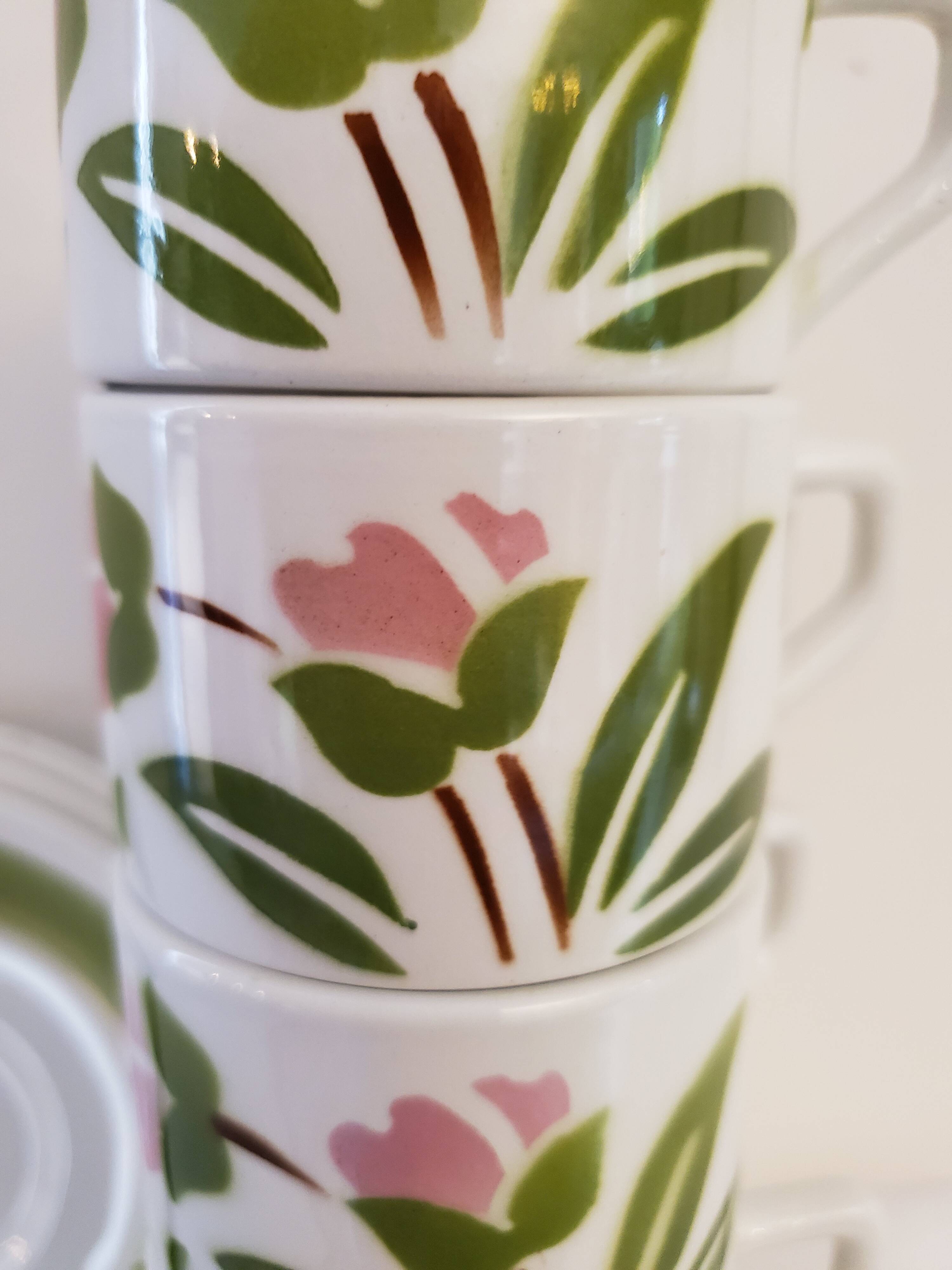 5 cups and ceramic saucers