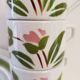 5 cups and ceramic saucers