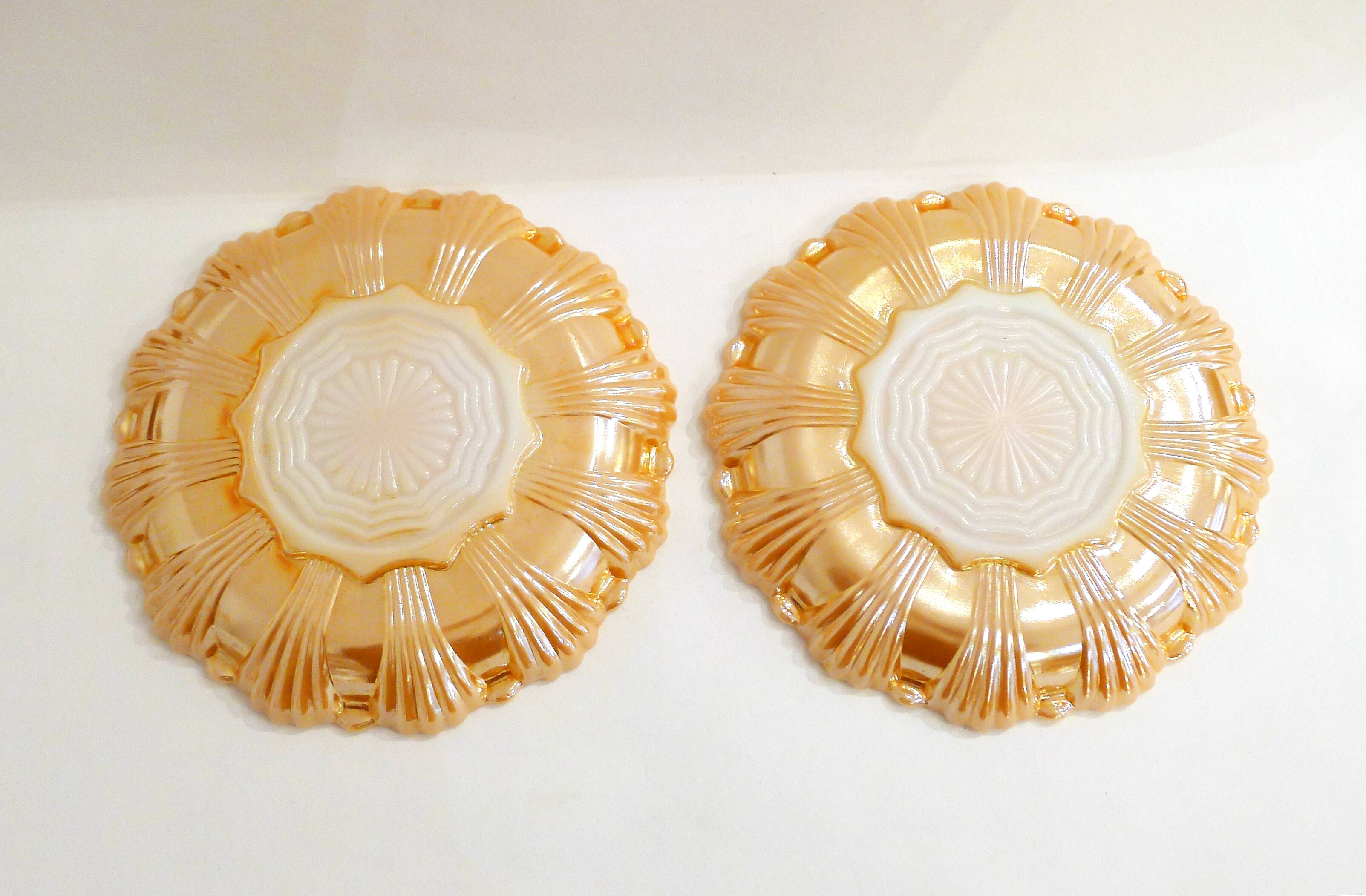 Pair of iridescent orange glass egg plates