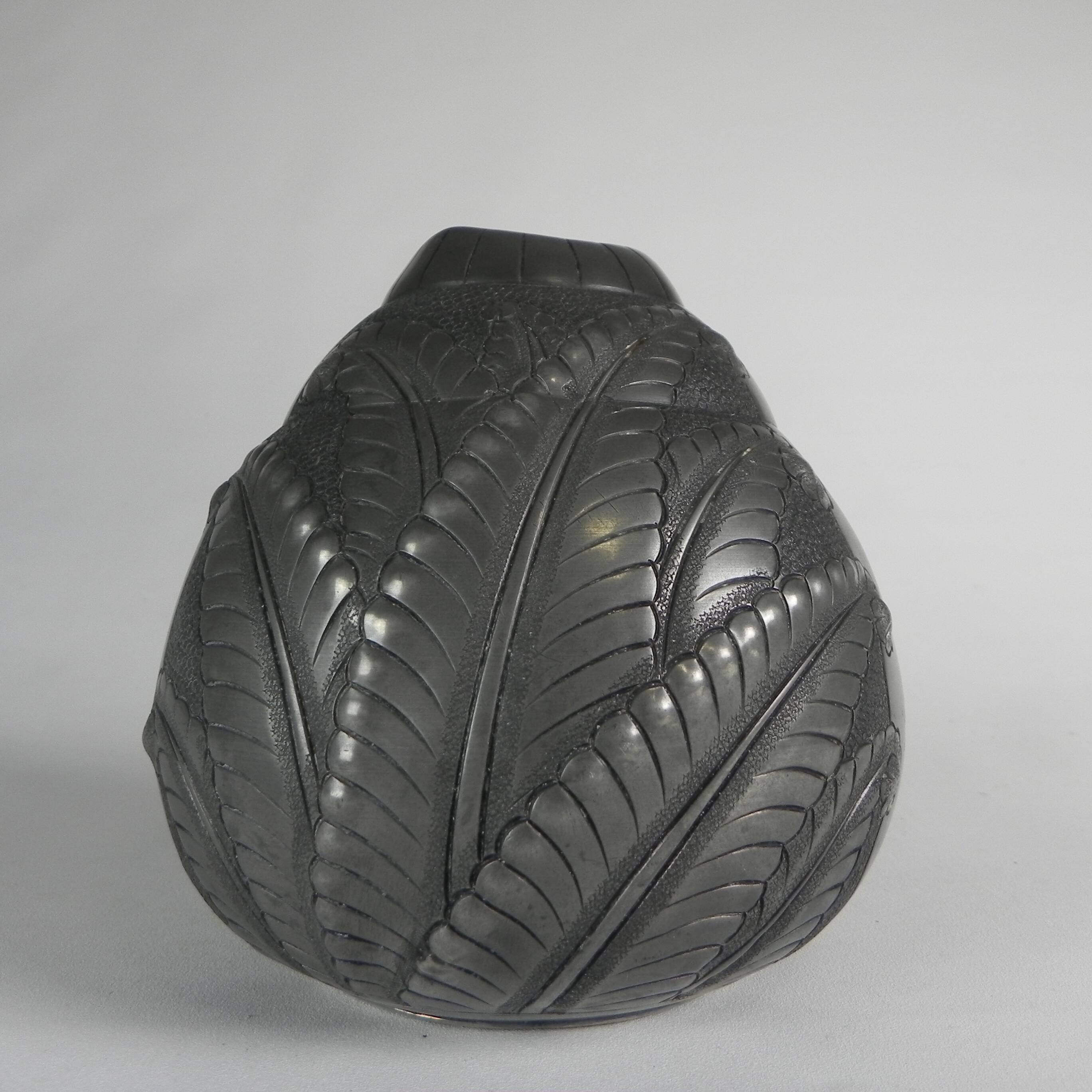Art Nouveau pewter vase, signed PETIZON, early 20th century.