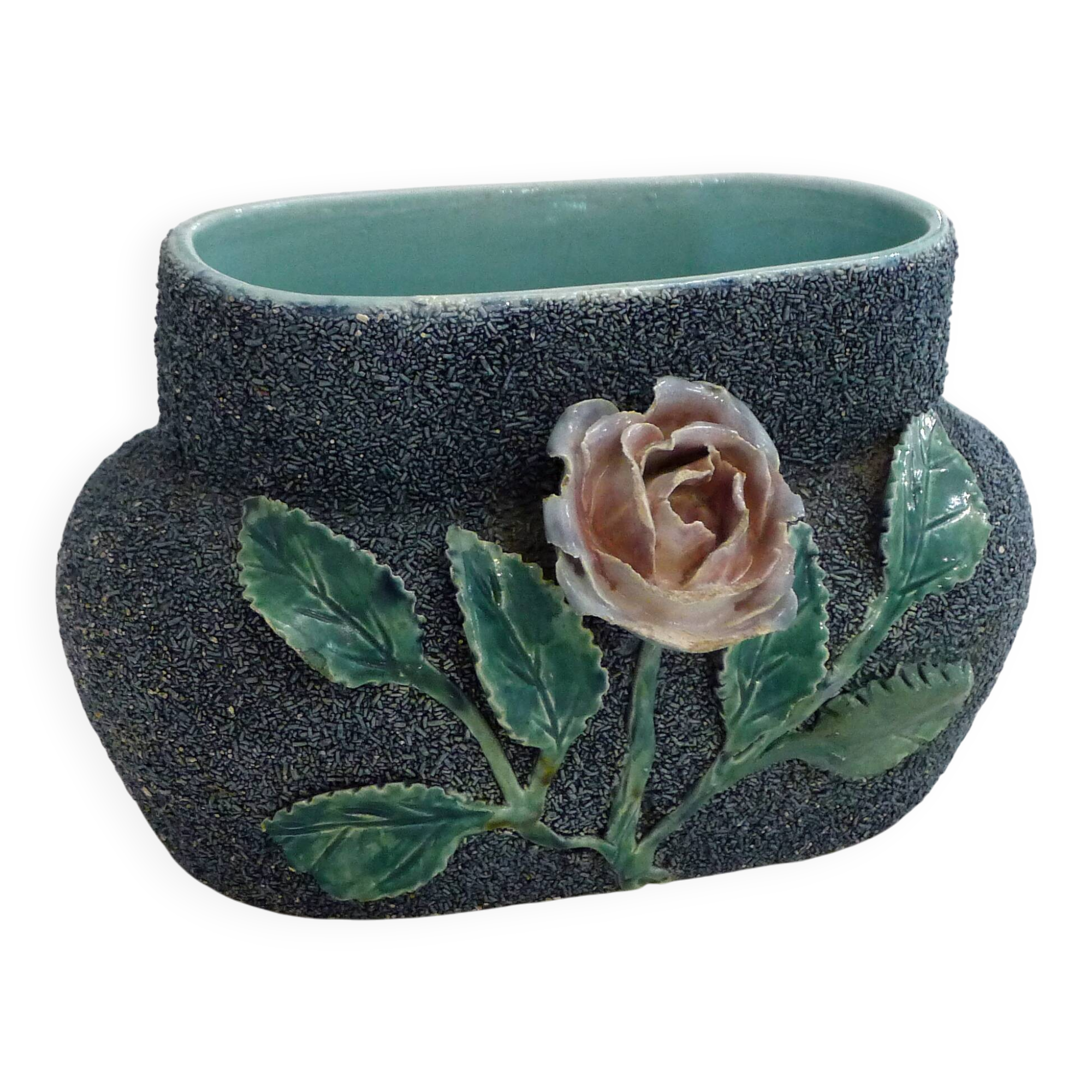 Antique jardinière with rose design in barbotine pottery.