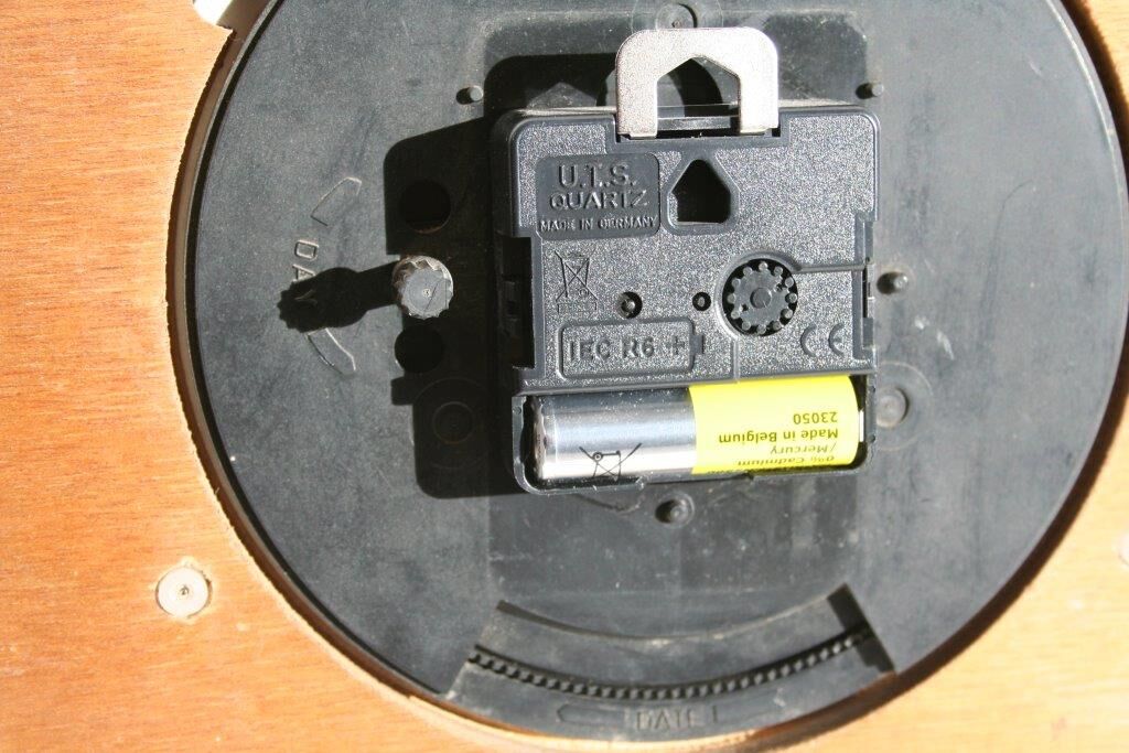 Vintage wall clock in orange formica