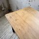 Oak farmhouse table with turned black legs.