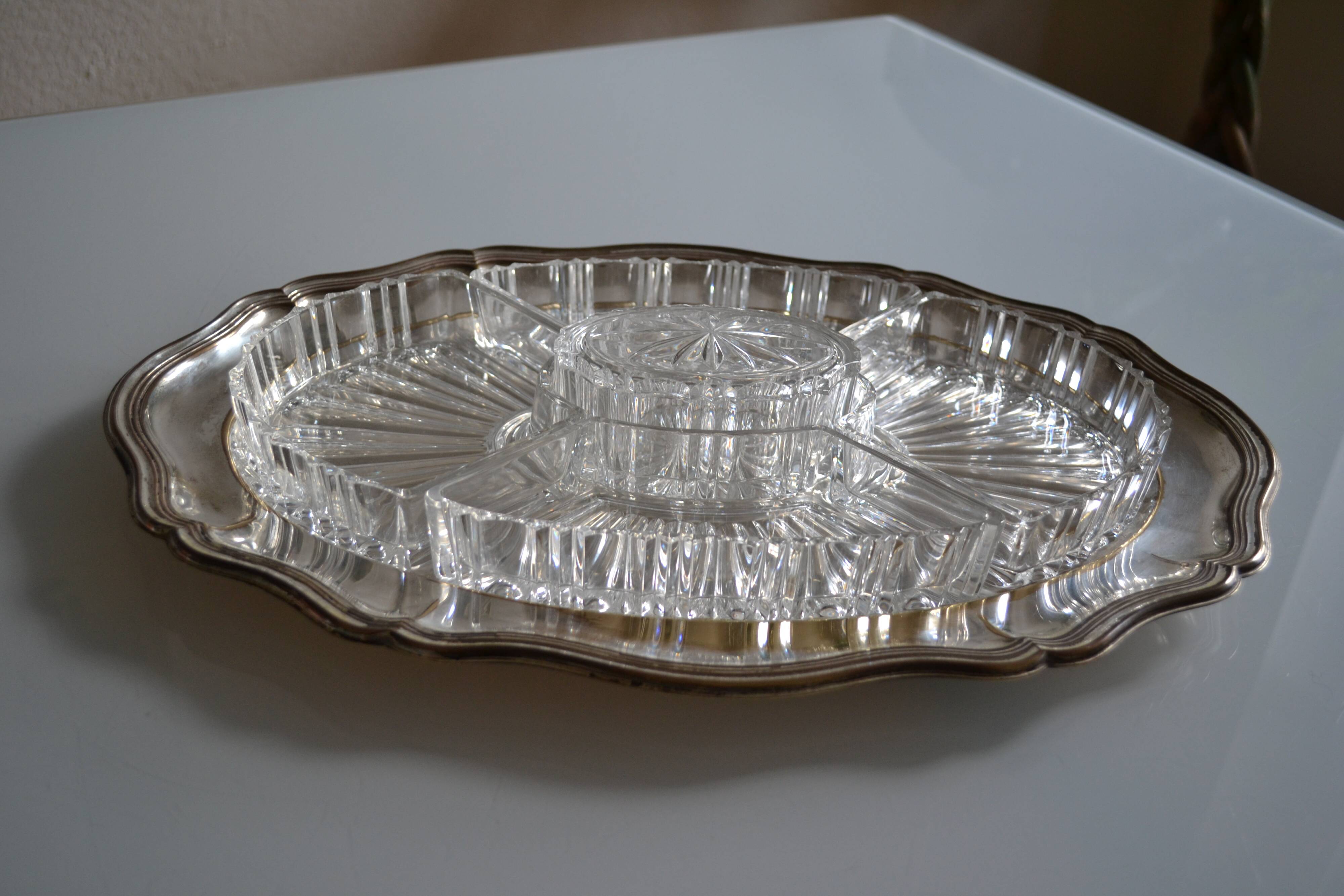 Silver-plated metal aperitif serving tray with HKE hallmark and glass.