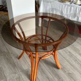 Table à manger verre fumé et rotin