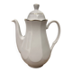Vintage coffee pot in white porcelain with a gold trim.