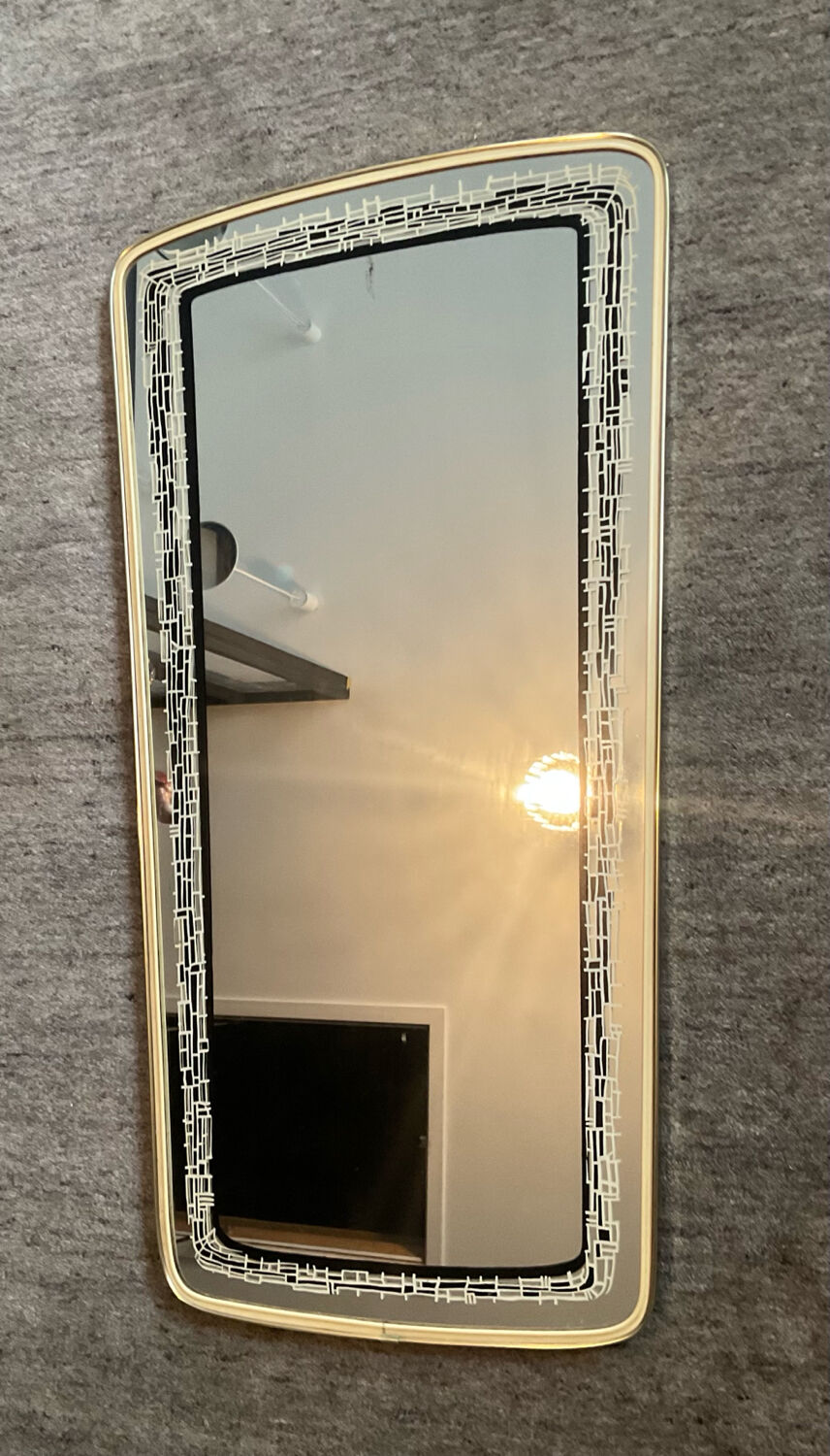 Asymmetrical free-form mirror from the 1970s