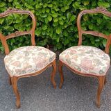 Pair of Louis XV chairs in carved walnut.