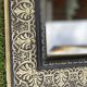 Bevelled mirror from the 19th century with gold and black palmettes.