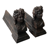Pair of cast iron pegs