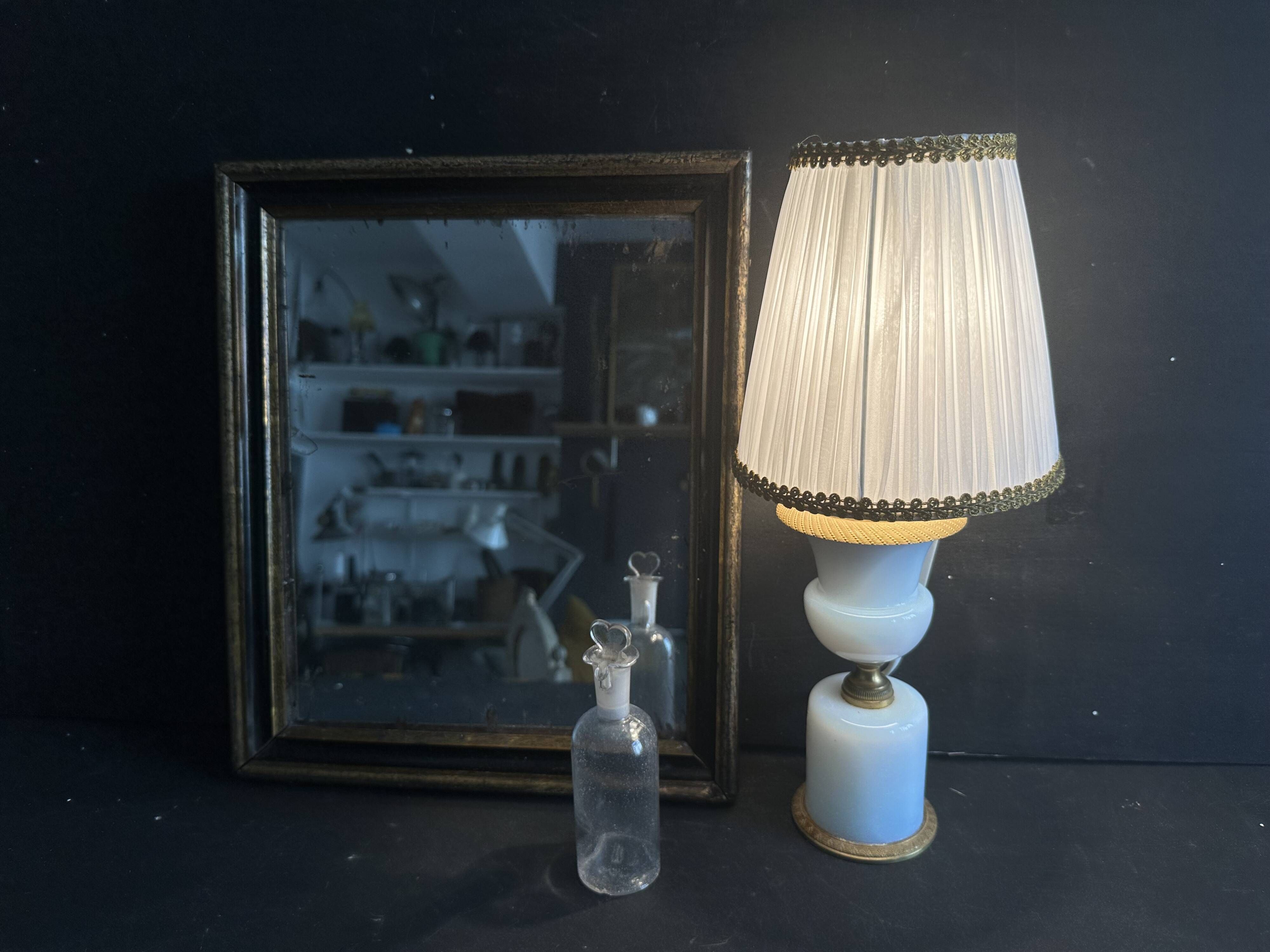 Miroir Napoléon III en bois noir et doré, XIXe siècle