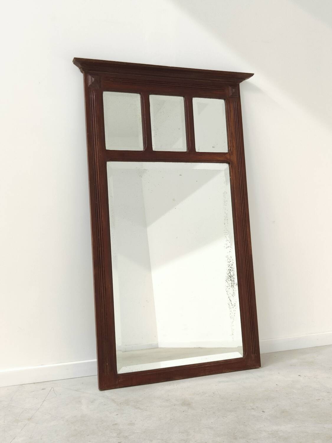 Antique beveled mirror on a wooden frame, 1930